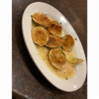 Baked Clams Oreganata · Six clams on the half shell stuffed with the works.