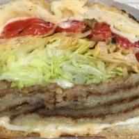 Eggplanter · Breaded eggplant, melted muenster cheese, roasted peppers, lettuce, russian dressing on a to...