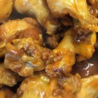 Buffalo Chicken Wings (10.99 Lb. 14 Pc Approx.) · Choice of: Mango Habanero, BBQ, Spicy Garlic and Buffalo Sauce.