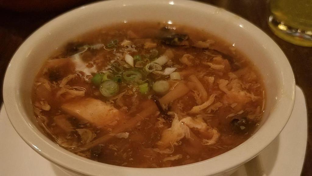 Qing'S Famous Hot & Sour Soup - Large · Rich & tangy broth with tofu, black wood ear mushroom, shredded bamboo shoots, mushroom, egg drop and ground black pepper. Spicy