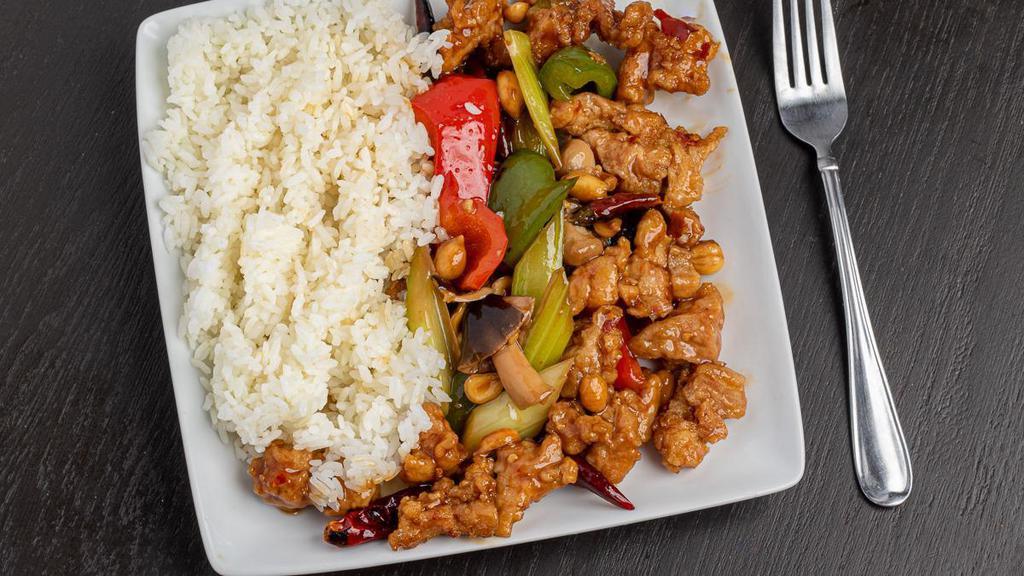 Kung Pao Chicken · Dried chili, celery, green & red pepper, straw mushroom, peanuts with tender, bite-sized chicken. Spicy dish and it contains nuts