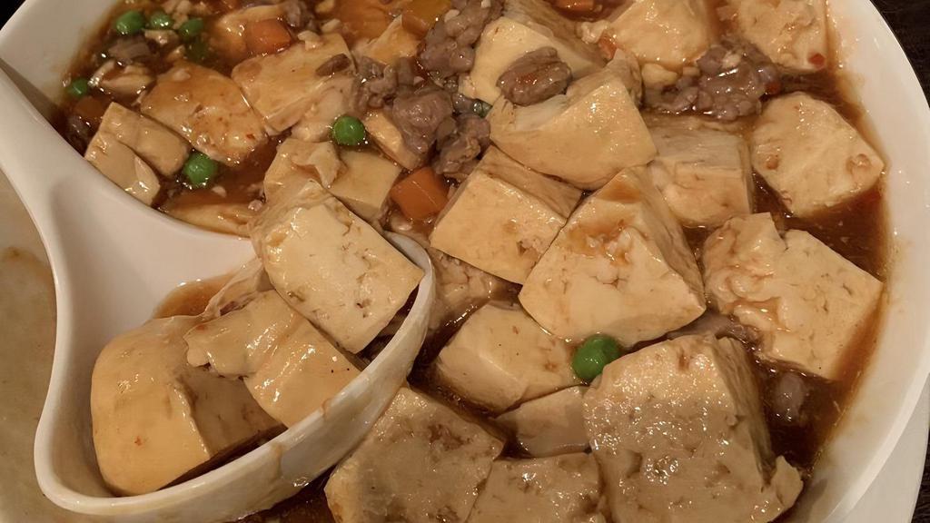 Ma Po Tofu · Silky tofu, ground pork, diced carrots, green peas and spicy garlic sauce. Spicy dish