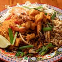 Pad Thai (L) · Thin rice noodle sauteed with egg, radish, bean sprouts in tamarind sauce