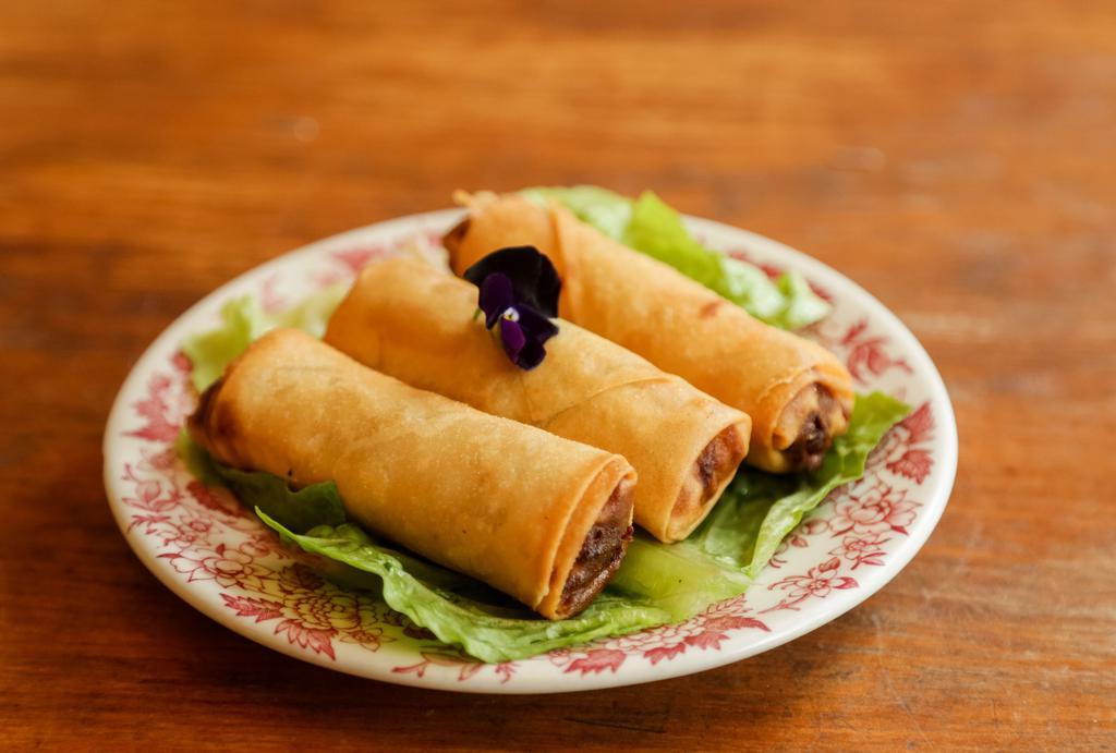 Veggies Spring Rolls · Cabbage, carrot, glass noodle wrapped in the rice wraps.