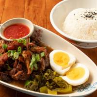 Ka Moo Pork Knuckle · Over night slow-simmering with Chinese five spice, egg, pickle cabbage with rice.