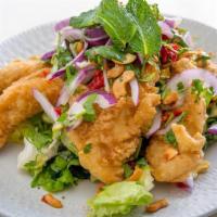 Pla Lui Suan · Fried fish with thai herbs, cashews and spicy lime sauce.