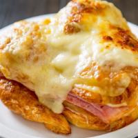 Classic French Ham And Cheese Croissant Sandwich · French ham bechamel sauce and Swiss cheese.
