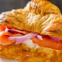 Smoked Salmon, Cream Cheese And Red Onions Sandwich On A Croissant · 