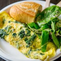 Spinach And Goat Cheese Omelette · Served with side of salad and a piece of baguette. Made with 3 eggs.