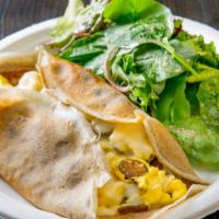 La Merguez Crepe · Gluten free. Crepe with scrambled eggs, spicy lamb sausage and melted Swiss cheese. Served w...