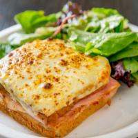 Croque Monsieur · White bread with bechamel sauce, French ham and melted Swiss cheese. Served with a side of m...