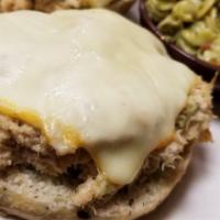 Tuna Melt · Open faced on an organic multi grain roll with melted Muenster cheese. Served with choice of...