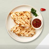 Shrimply Quesadillas · Fresh shrimp seasoned and wrapped with cheese in a grilled tortilla with pica de gallo.