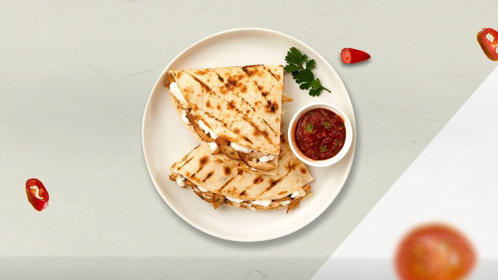 The Meaty Asada Quesadilla · Grilled steak seasoned and wrapped with cheese in a grilled tortilla with pica de gallo.