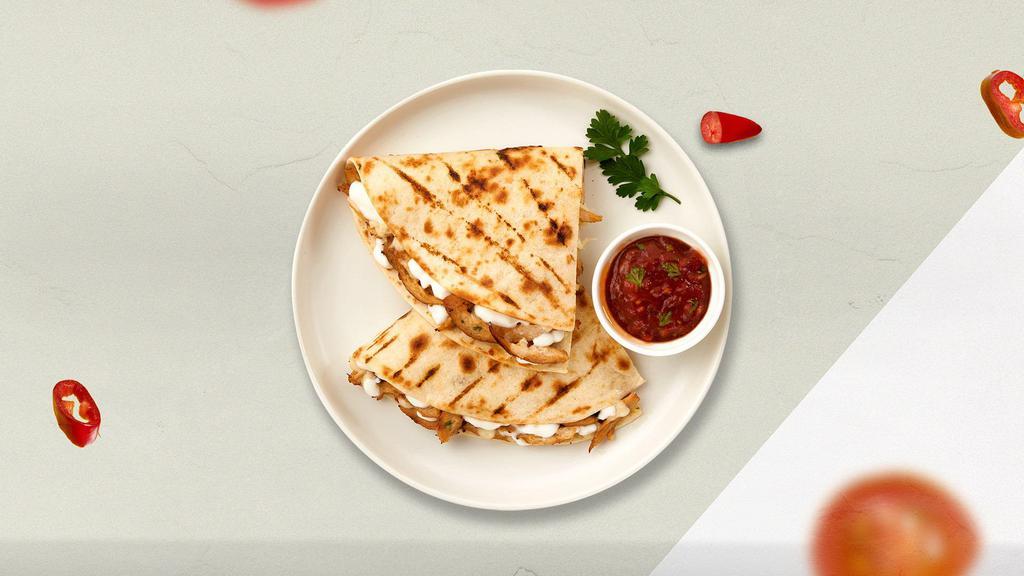 The Cheesy Breezy Quesadilla · Four cheeses wrapped in a grilled tortilla with pica de gallo.
