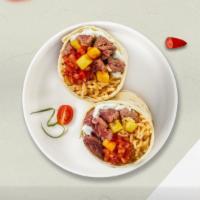 Johnny Pastrami Burrito · Pastrami topped with sour cream, salsa, cheese, and spanish rice wrapped in a warm tortilla ...