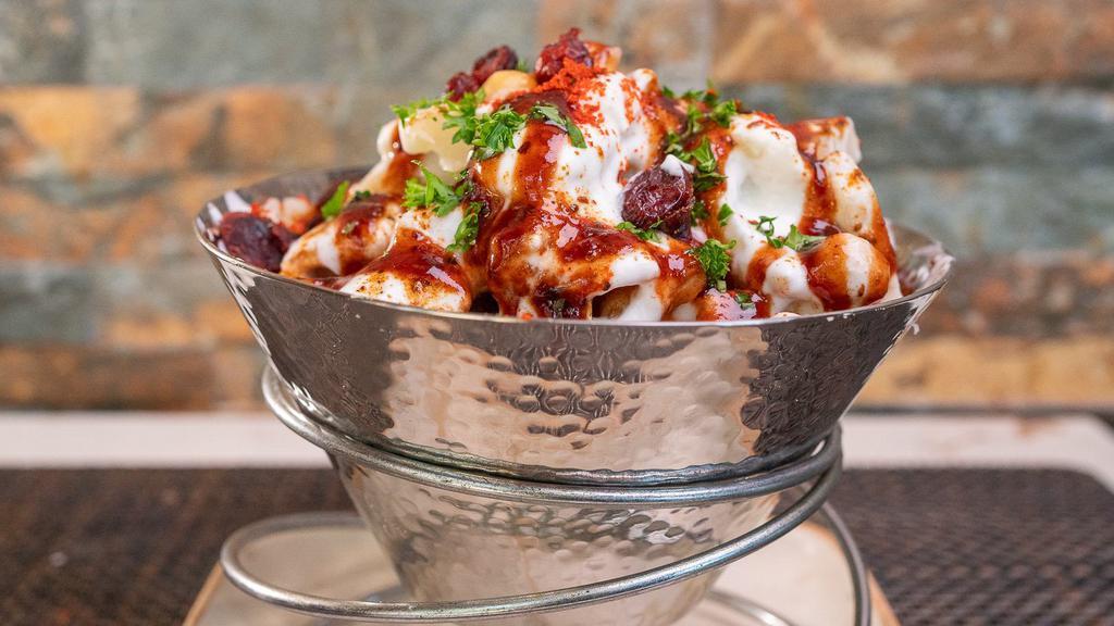 Papri Chaat · Crunchy fried snack with chickpeas, potatoes, yogurt & spices