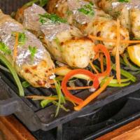 Chandni Seekh · Seasoned Indian cottage cheese and khoya on skewers, coated with edible silver