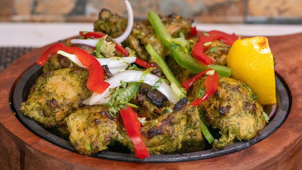 Haryali Murgh Tikka · Chicken thighs marinated in a blended mixture of mint & coriander leaves, curd along with a melange of flavorsome spices