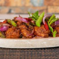 Chilli Chicken Dry · Diced chicken tossed in onion, pepper & spicy sauce