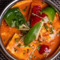 Paneer Tikka Masala · Marinated & char grilled chunks of paneer simmered cooked in a rich tomato gravy