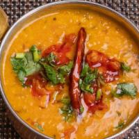 Yellow Dal Tadka · Lentil curry flavored with tempered garlic, herbs & spices