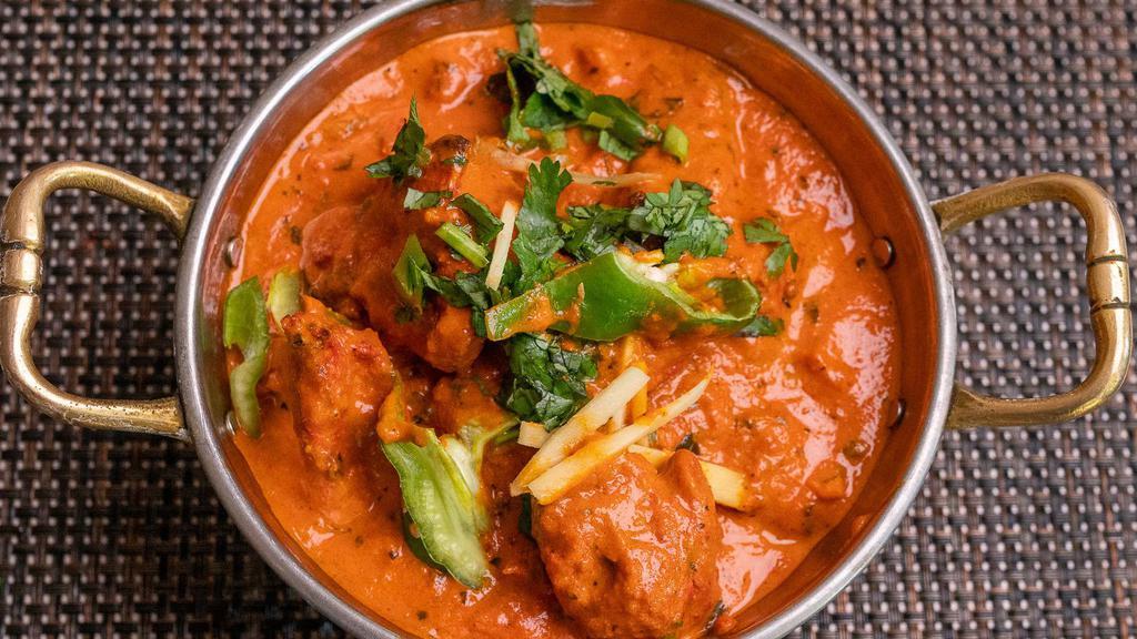 Murgh Tikka Masala · Marinated & char grilled chunks of chicken simmered & cooked in a rich tomato gravy