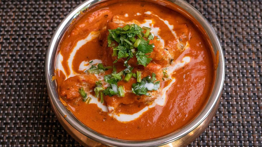 Butter Chicken · Charcoal roasted tender chicken simmered, in a tomato sauce, finished with butter & cream