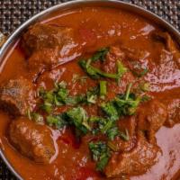 Gosht Rismisa · Tender curried lamb spiced with pureed onion, garlic & ginger