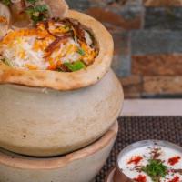 Gosht Biryani · An exotic blend of basmati rice, assorted vegetables and traditional spices and herbs, layer...