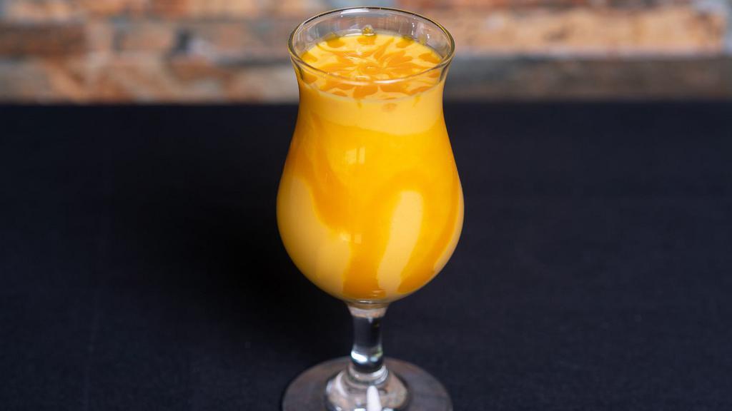 Mango Lassi · Refreshing yogurt drink with mango