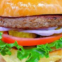 Meatless Burger (Impossible Burger) · Plant based burger patty ,brioche burger bun, lettuce ,tomatoes, onions and pickles.