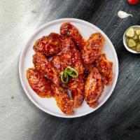 Seoul Kick Wings  · Fresh chicken wings breaded, fried until golden brown, and tossed in soy sauce, brown sugar,...