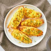 Cheesy Garlic Bread · Classic garlic bread baked to perfection, topped with cheese!