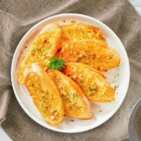 Garlic Bread Between The Lines · Classic garlic bread baked to perfection.