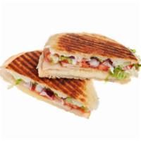 New Ro Turkey Panini · Fresh pressed Panini made with Delicious sliced turkey, jack cheese with onions, sun dried t...