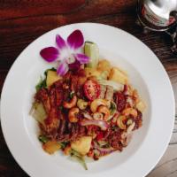 Crispy Duck Salad · Gluten free. Spicy. Salad with chili, red onion, pineapple, cashew nuts and scallion with sp...