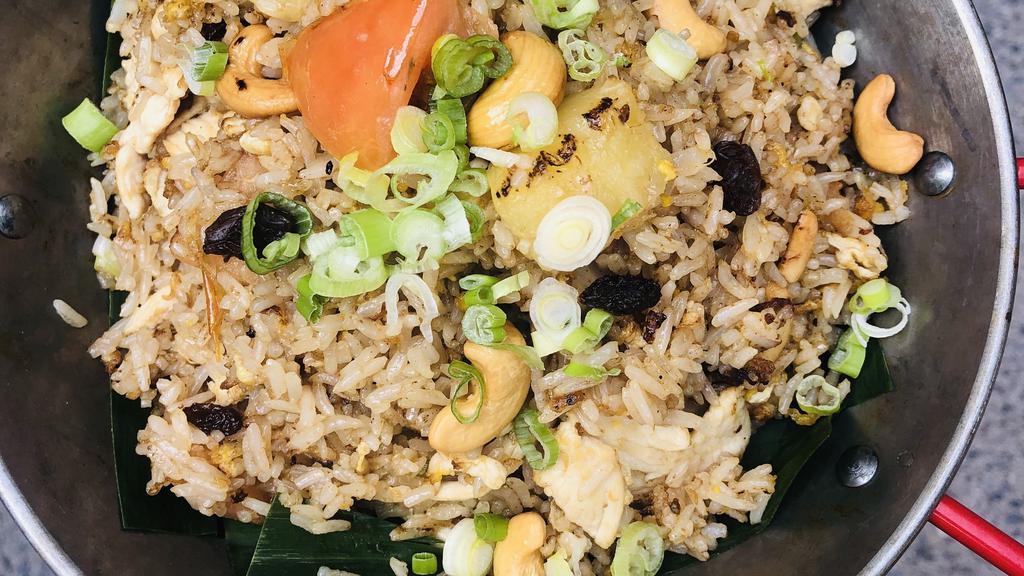 Pineapple Fried Rice · Comes with pineapple, cashew nut, onion, tomato, raisin, scallion and egg.