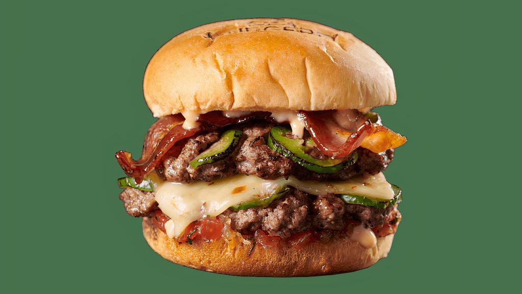 Swag (Spicy Wagyu) Burger · Double Wagyu + Brisket Blend Burger, Charred Jalapenos, Candied Ghost Pepper Bacon, Sweet Tomato Relish, Habanero Pepper Jack Cheese, and Hot Steak Sauce. (Cals 808)