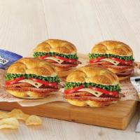 Ham Or Turkey Classic Sandwich 4-Pack · Four ham or turkey classic sandwiches with four packs of chips.