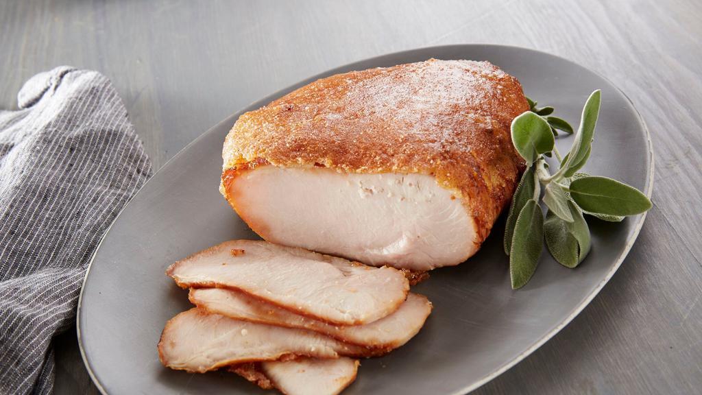 Roasted Turkey Breast · Slow-roasted and seasoned with the perfect blend of herbs and spices for a juicy, tender and delicious Roasted Turkey experience. HoneyBaked has changed boring, predictable turkey. You may think you've had turkey before, but if you've never had Honey Baked Turkey Breast, you have a whole new experience in store. Turkey has never tasted so good! Slow-roasted and perfectly seasoned for the most juicy, tender and delicious taste infused into every bite. It's indulgence as its best - everyone loves it. We think you'll agree that this turkey is like no other - and is the World's Best Turkey. Premium 100% white breast meat and hand-crafted in store with our sweet crunchy glaze. Fully cooked, pre-sliced and ready to serve. 2.5 - 3 lbs. Serves 6-8