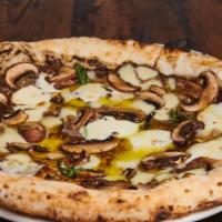 Tartufo Pizza · Fresh mozzarella, Parmesan, fresh mushrooms, truffle puree oil, and basil.