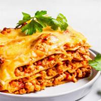 Spicy Meat Lasagna · Freshly prepared by order with layers of pasta, ricotta, parmesan, cheddar, mozzarella, grou...
