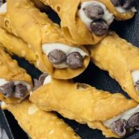 Cannolis · Cannolis filled with delicious cream made with ricotta cheese, whipping cream and chocolate ...