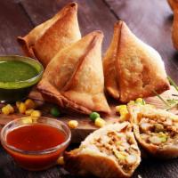 Famous Indian Chicken Samosa · 3 Pcs. Hot fried pastry shells stuffed with roasted minced chicken and cumin potatoes, serve...