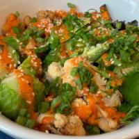 Buddha Bowl · Quinoa, brussels sprouts, roasted chickpeas, sweet potato, cauliflower, avocado, and red pep...