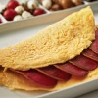 Pastrami Omelette · Fluffy and fresh deli special pastrami filled omelette, served with our house special home f...