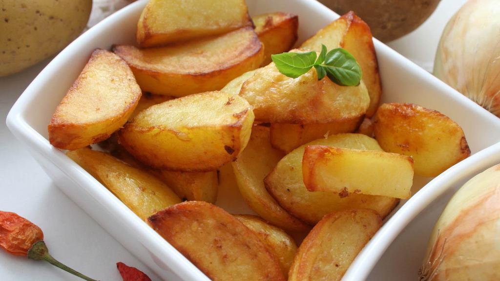 Home Fries · Classic thick sliced baked potato wedges tossed in our special seasoning.