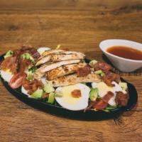 Chicken Avocado · Sliced grilled chicken breast with mixed greens, bacon, a hard-boiled egg, tomatoes, cucumbe...