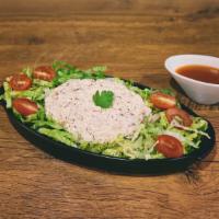 Tuna Salad · Our freshly made tuna salad laid on a bed of lettuce and tomato